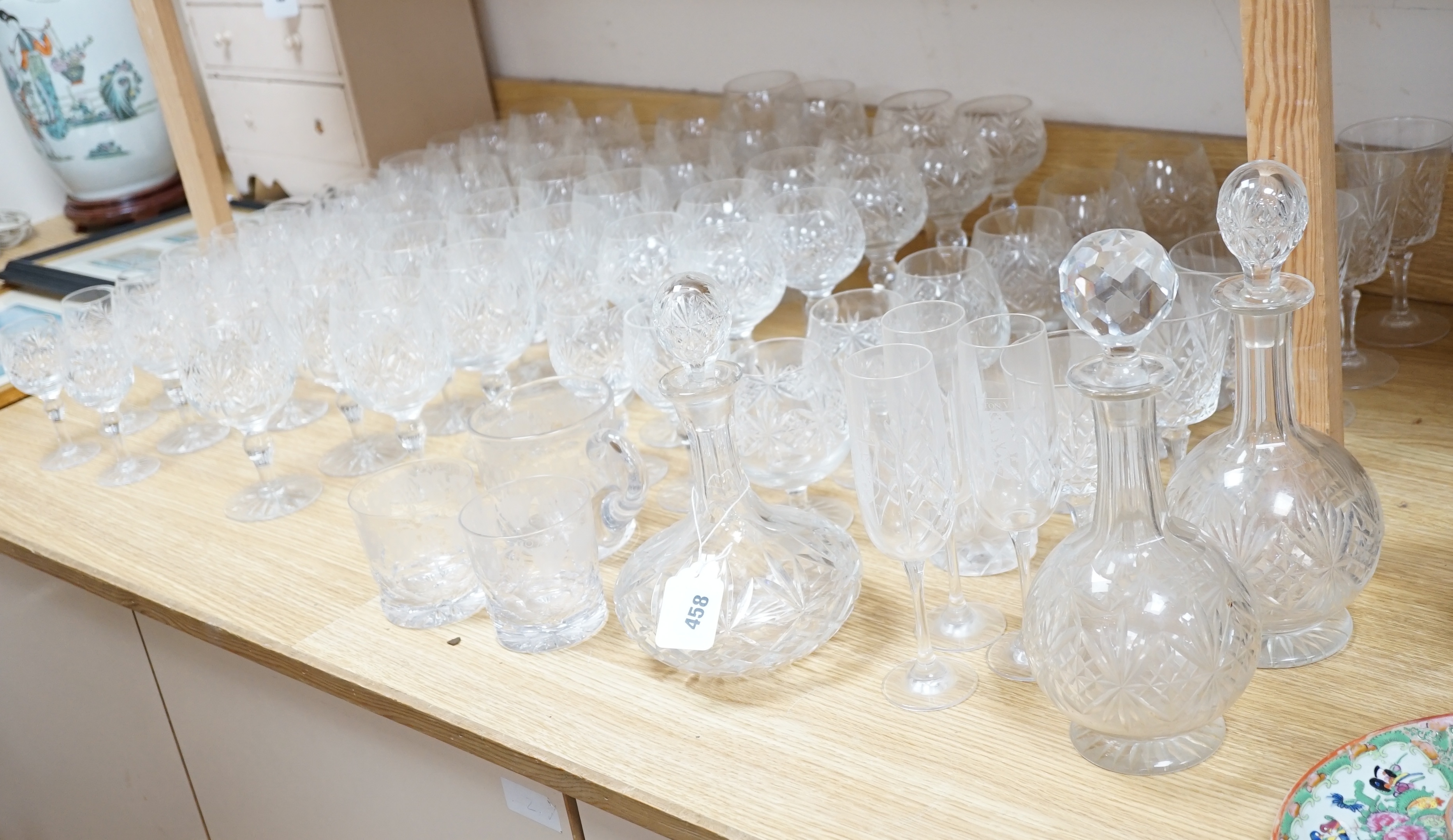 Various suites of star cut Thomas Webb drinking glasses, together with three decanters, pair of whisky tumblers and jug, five tumblers and three engraved Aston Villa champagne flutes, (approx. 89 items)